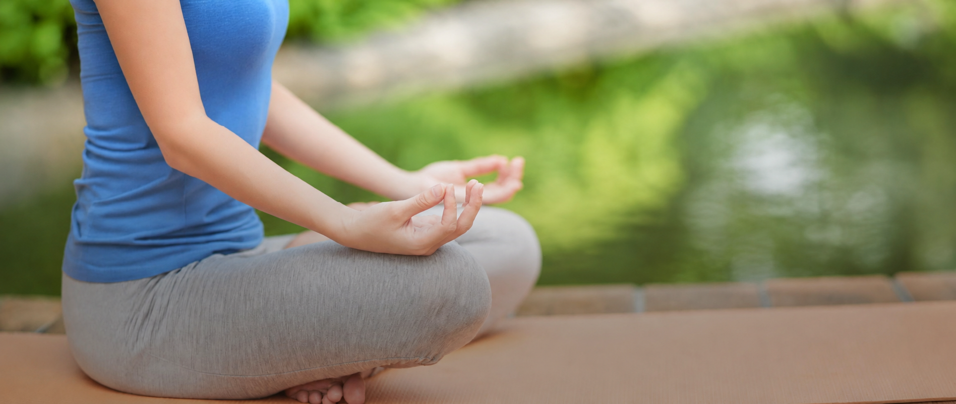 A person practising mindful meditation outdoors